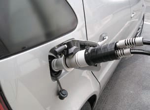 Hydrogen fuel car at fueling station Hydrogen fuel car at fueling station